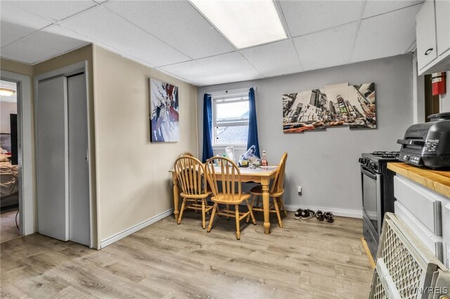 547 Potomac Ave, Buffalo, NY 14222 - dining area with light hardwood / wood-style floors and a drop ceiling