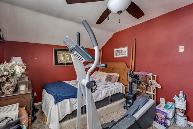 carpeted bedroom with ceiling fan, vaulted ceiling, and heating unit