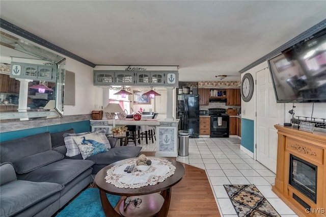 tiled living room featuring ornamental molding