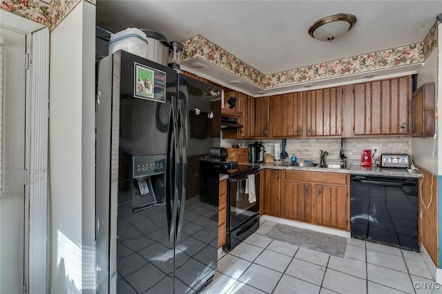 kitchen with sink, light tile patterned floors, decorative backsplash, and black appliances