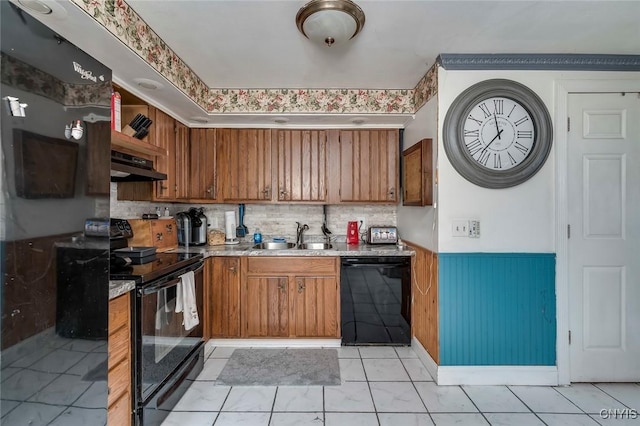 kitchen with tasteful backsplash, sink, and black appliances