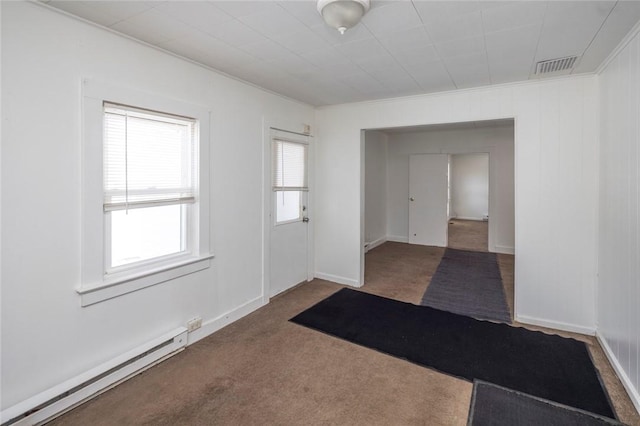 foyer entrance with a baseboard radiator and carpet floors