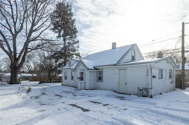 view of snow covered house