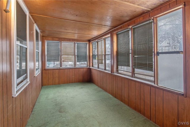 unfurnished sunroom with wooden ceiling