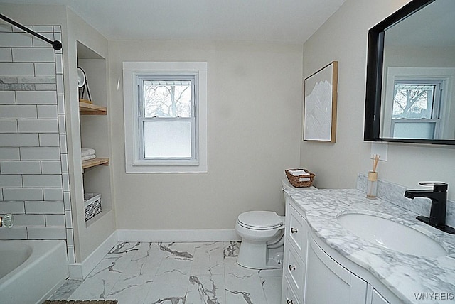 full bathroom featuring vanity, tiled shower / bath, and toilet