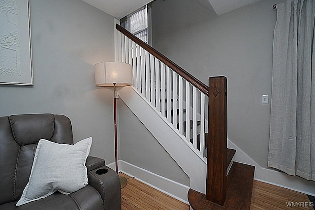 stairs with wood-type flooring