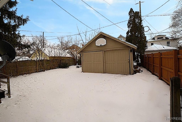 view of snow covered garage