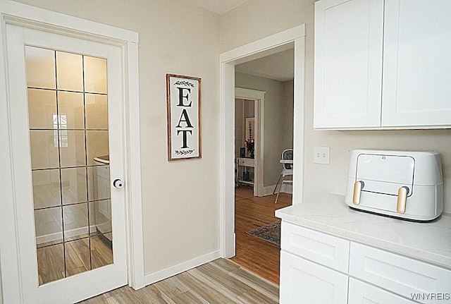 hallway featuring light hardwood / wood-style floors