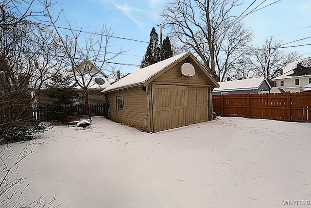 view of snow covered garage