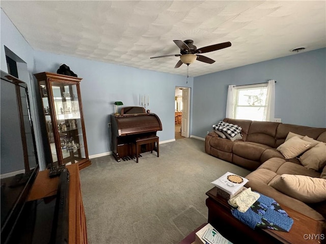 living room with ceiling fan and carpet floors