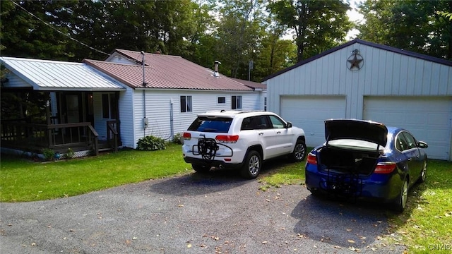 exterior space with a garage and a front yard