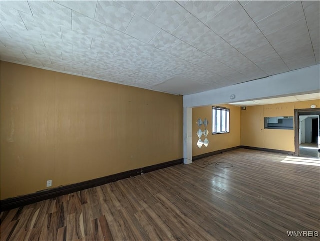 unfurnished living room featuring hardwood / wood-style flooring