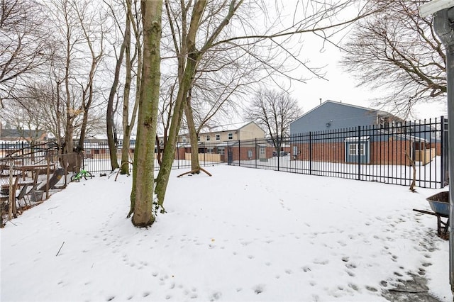 view of yard layered in snow