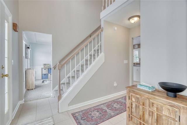 staircase featuring tile patterned flooring