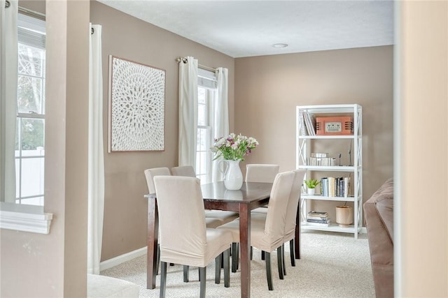 view of carpeted dining area