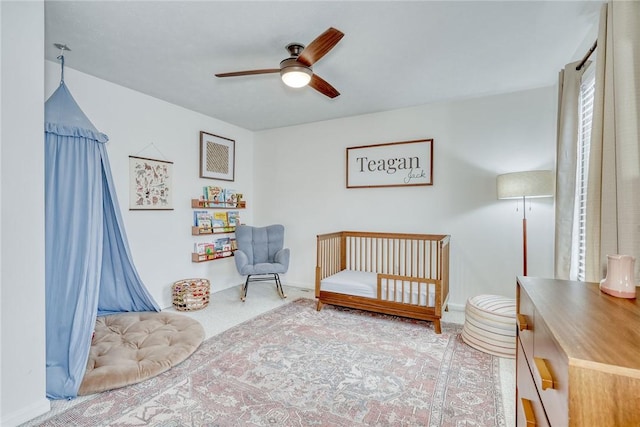 carpeted bedroom with ceiling fan