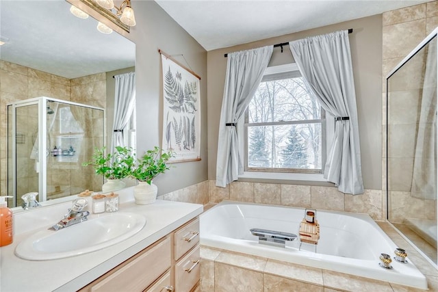 bathroom with a chandelier, vanity, and independent shower and bath