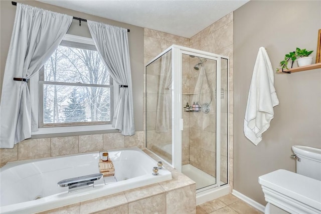 bathroom featuring a textured ceiling, tile patterned floors, independent shower and bath, and toilet