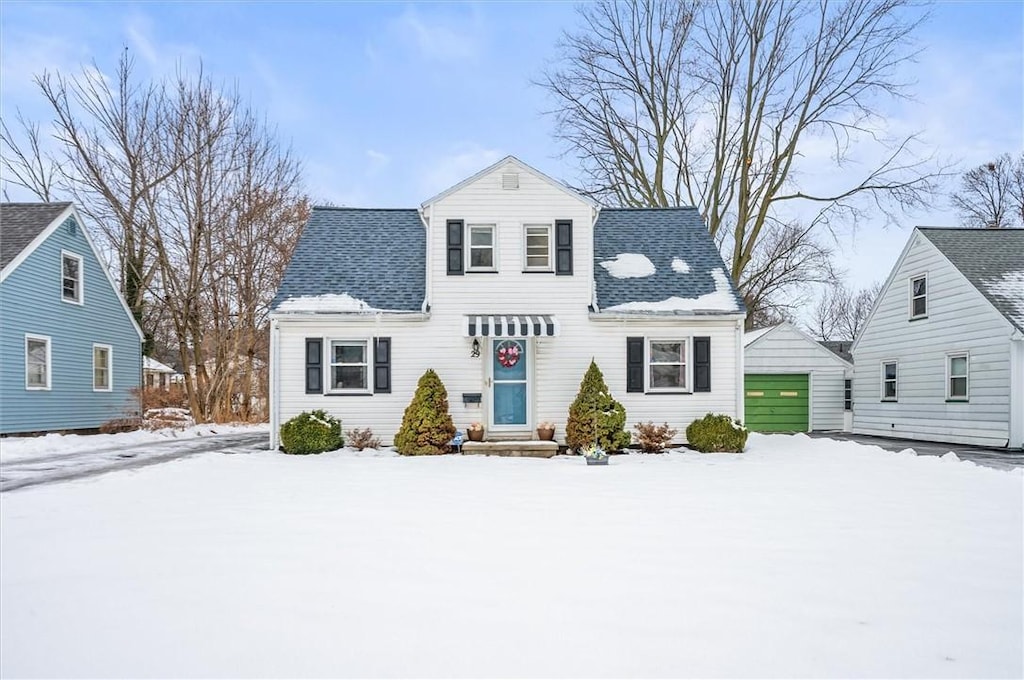 view of front of house featuring a garage and an outdoor structure