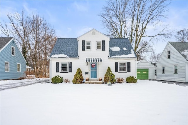 view of front of house featuring a garage and an outdoor structure