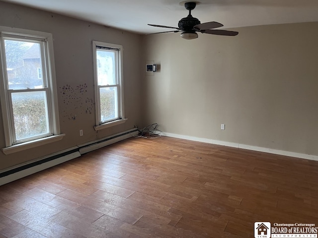 unfurnished room with baseboard heating, ceiling fan, and light hardwood / wood-style flooring