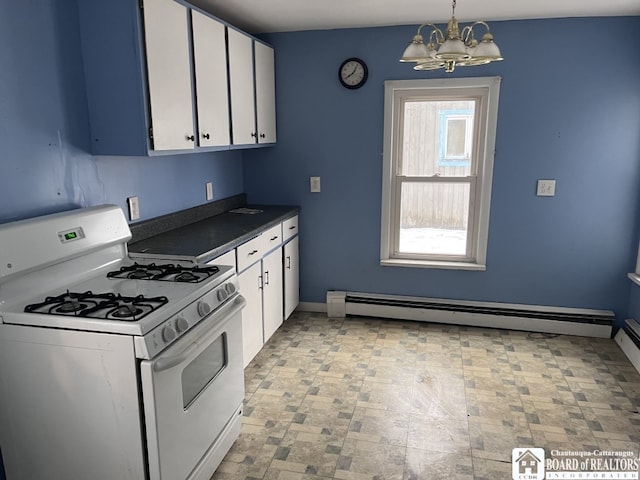 kitchen with white cabinets, hanging light fixtures, a baseboard heating unit, white gas stove, and an inviting chandelier