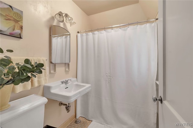 bathroom featuring sink and toilet