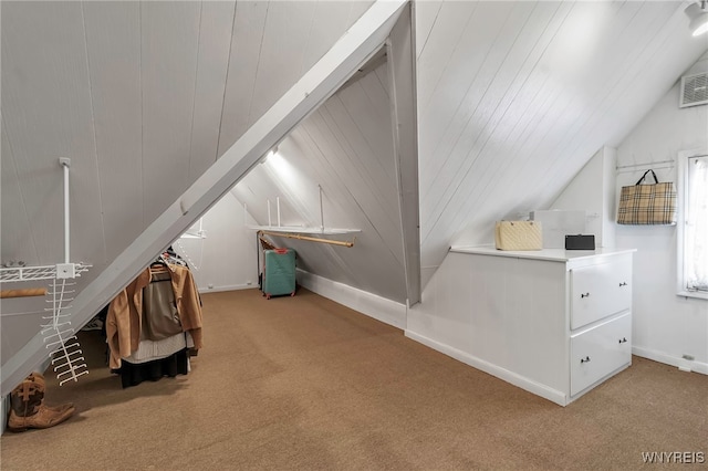 bonus room featuring light carpet and lofted ceiling