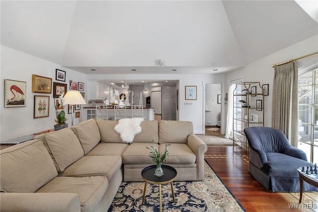 living room with dark hardwood / wood-style floors and high vaulted ceiling