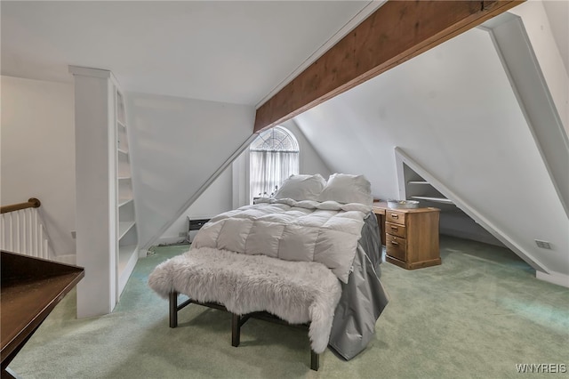 carpeted bedroom featuring lofted ceiling with beams