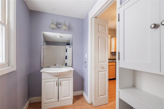 bathroom featuring vanity and hardwood / wood-style flooring