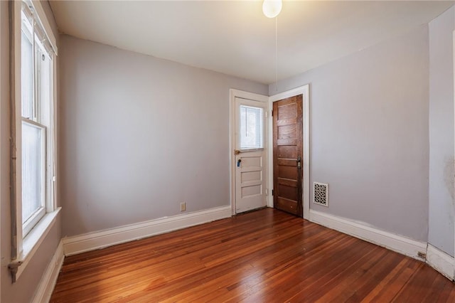 unfurnished room featuring wood-type flooring