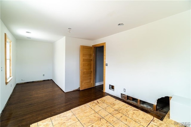 spare room with hardwood / wood-style flooring