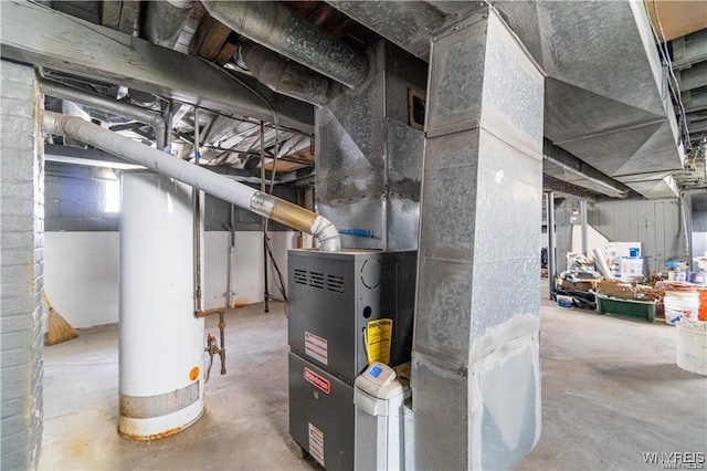 utility room featuring gas water heater