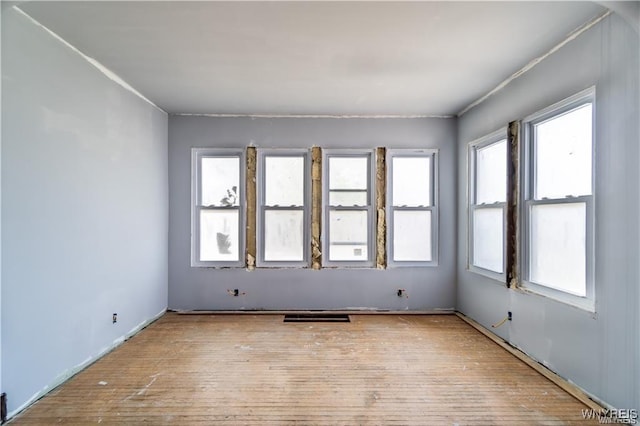 spare room with light hardwood / wood-style flooring