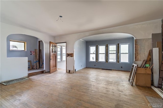 unfurnished room with light wood-type flooring