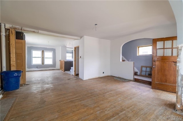 unfurnished living room with hardwood / wood-style floors