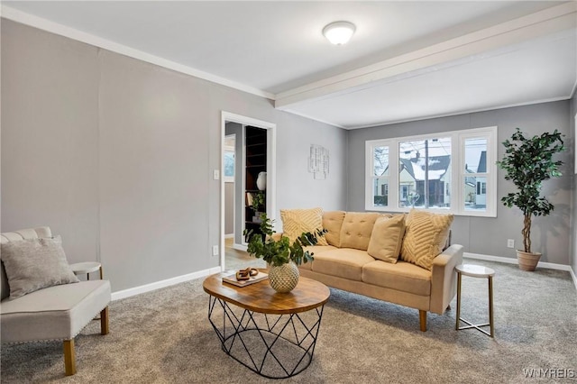 carpeted living room with crown molding and beam ceiling