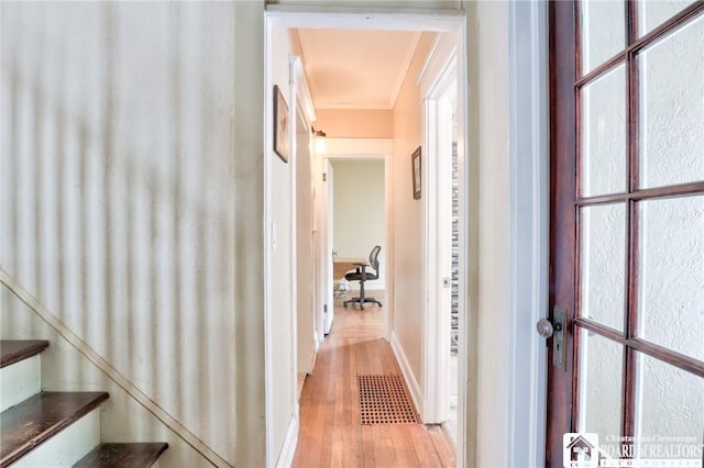 hall with light hardwood / wood-style flooring