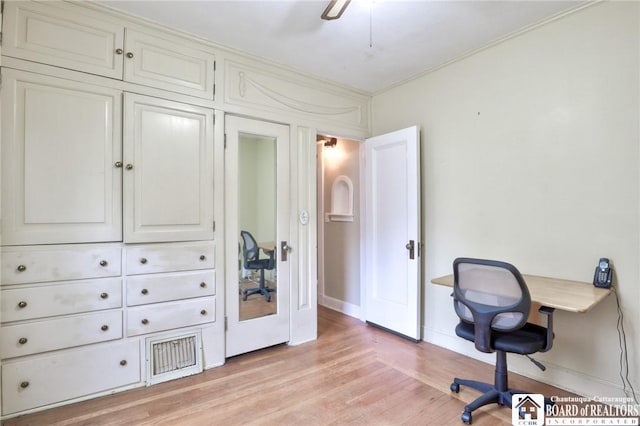 office space with ceiling fan, crown molding, and light wood-type flooring