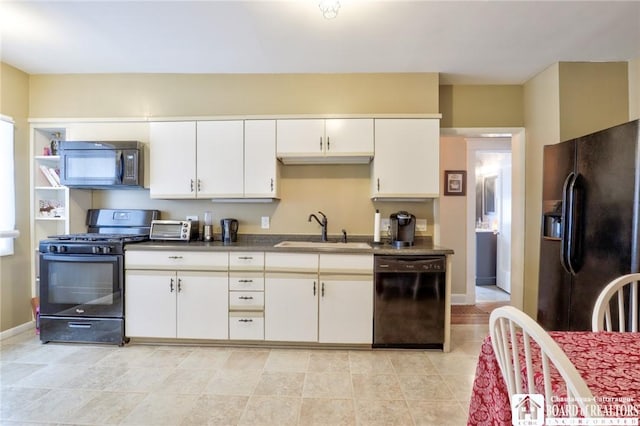 kitchen with white cabinetry, sink, light tile patterned floors, and black appliances