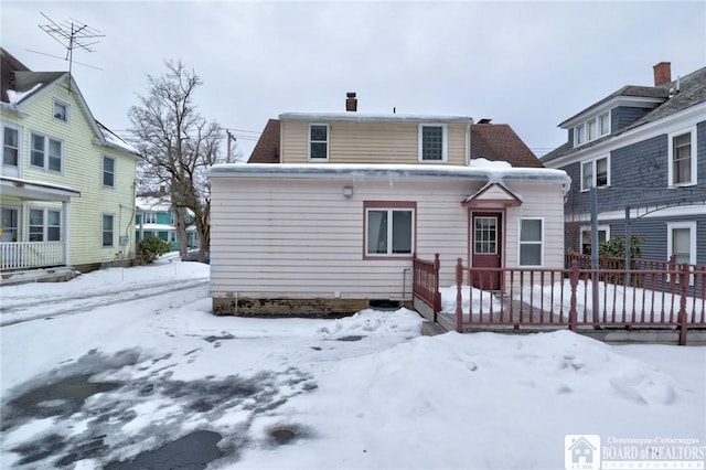 view of snow covered house