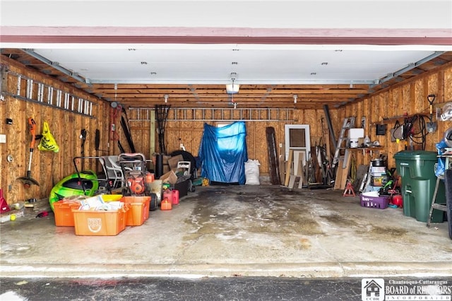 garage with wood walls