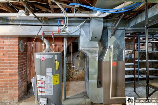 utility room featuring water heater and heating unit