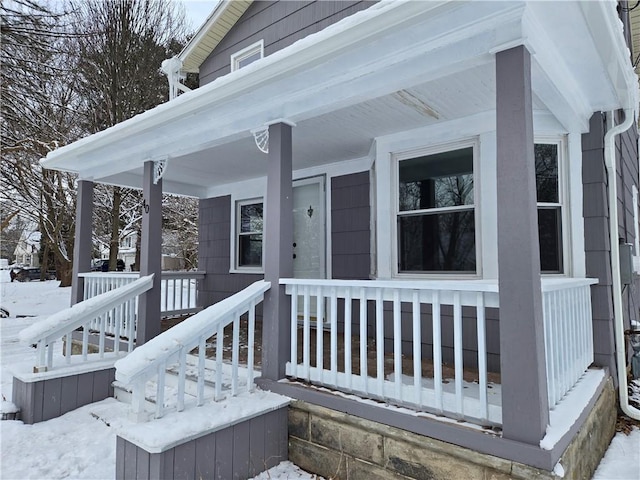 view of snow covered property entrance