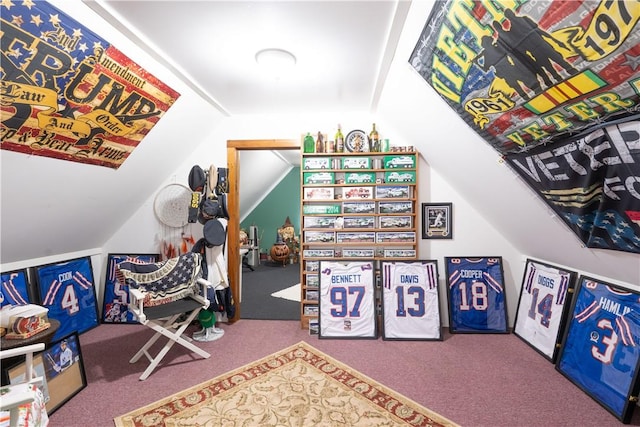 game room with vaulted ceiling and carpet