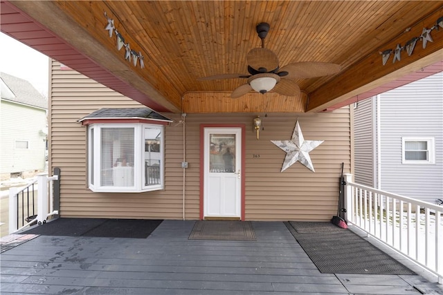 wooden terrace featuring ceiling fan