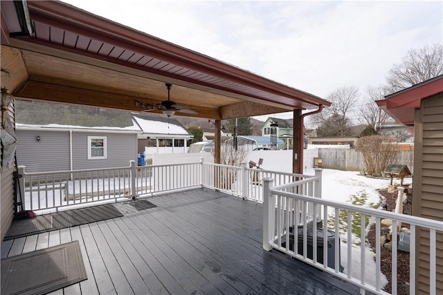 snow covered deck featuring ceiling fan