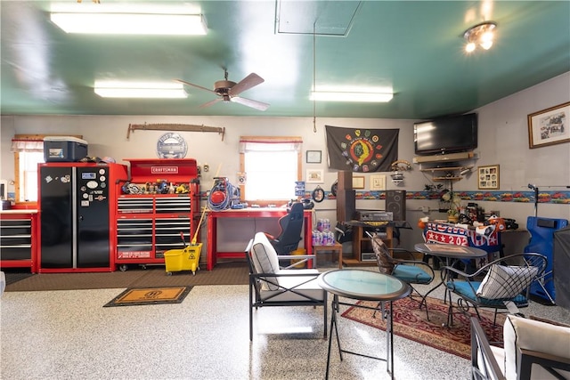 playroom featuring a workshop area and ceiling fan