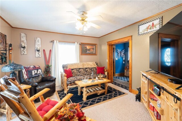 carpeted living room with crown molding, a textured ceiling, and ceiling fan